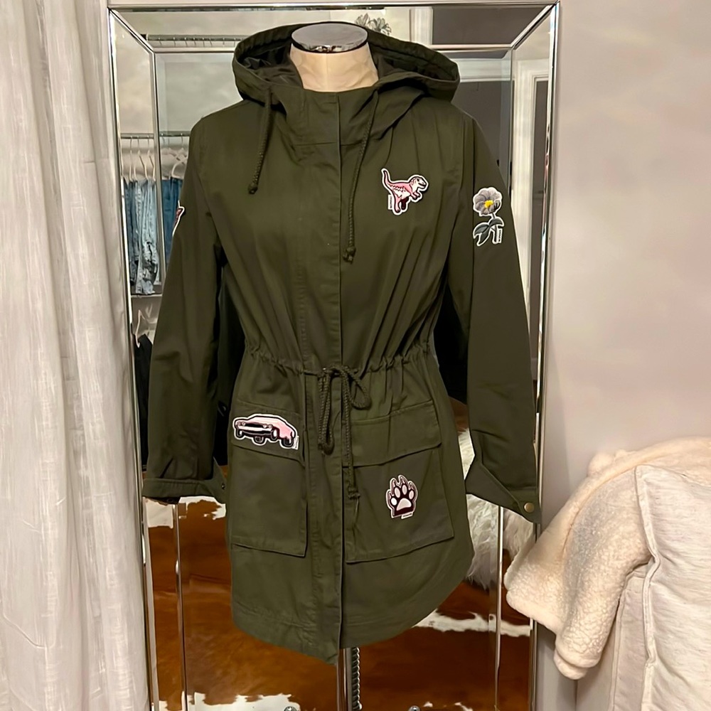 Coach Varsity Patches on army green jacket